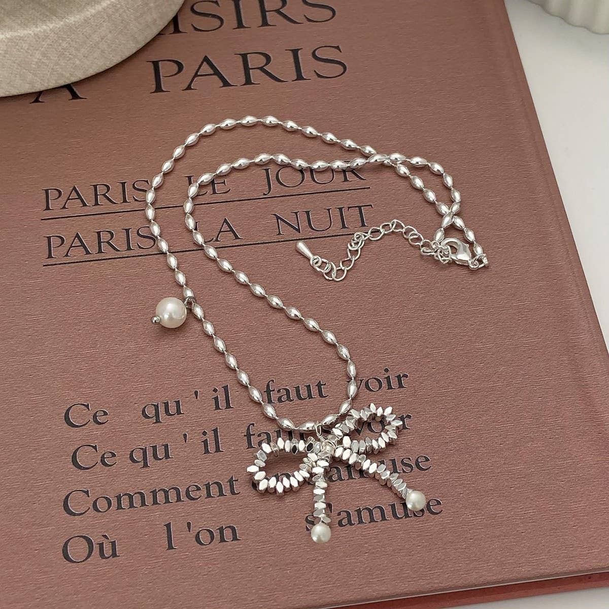 WOMEN'S PEARL AND SILVER BOW PENDANT NECKLACE