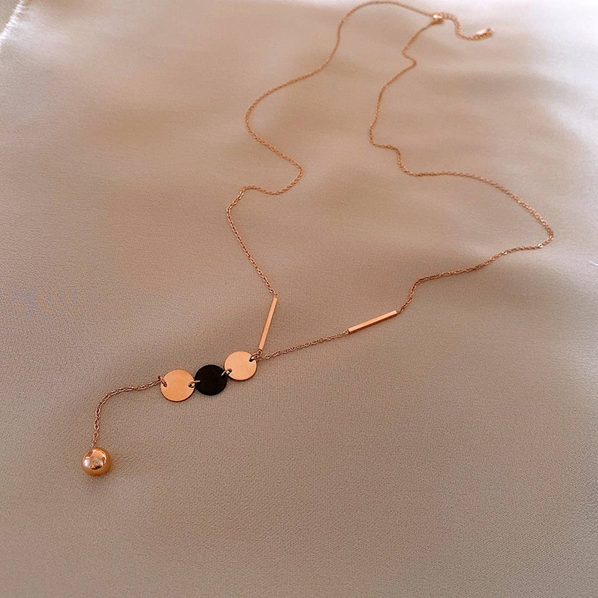 GEOMETRIC SEQUIN TASSEL NECKLACE