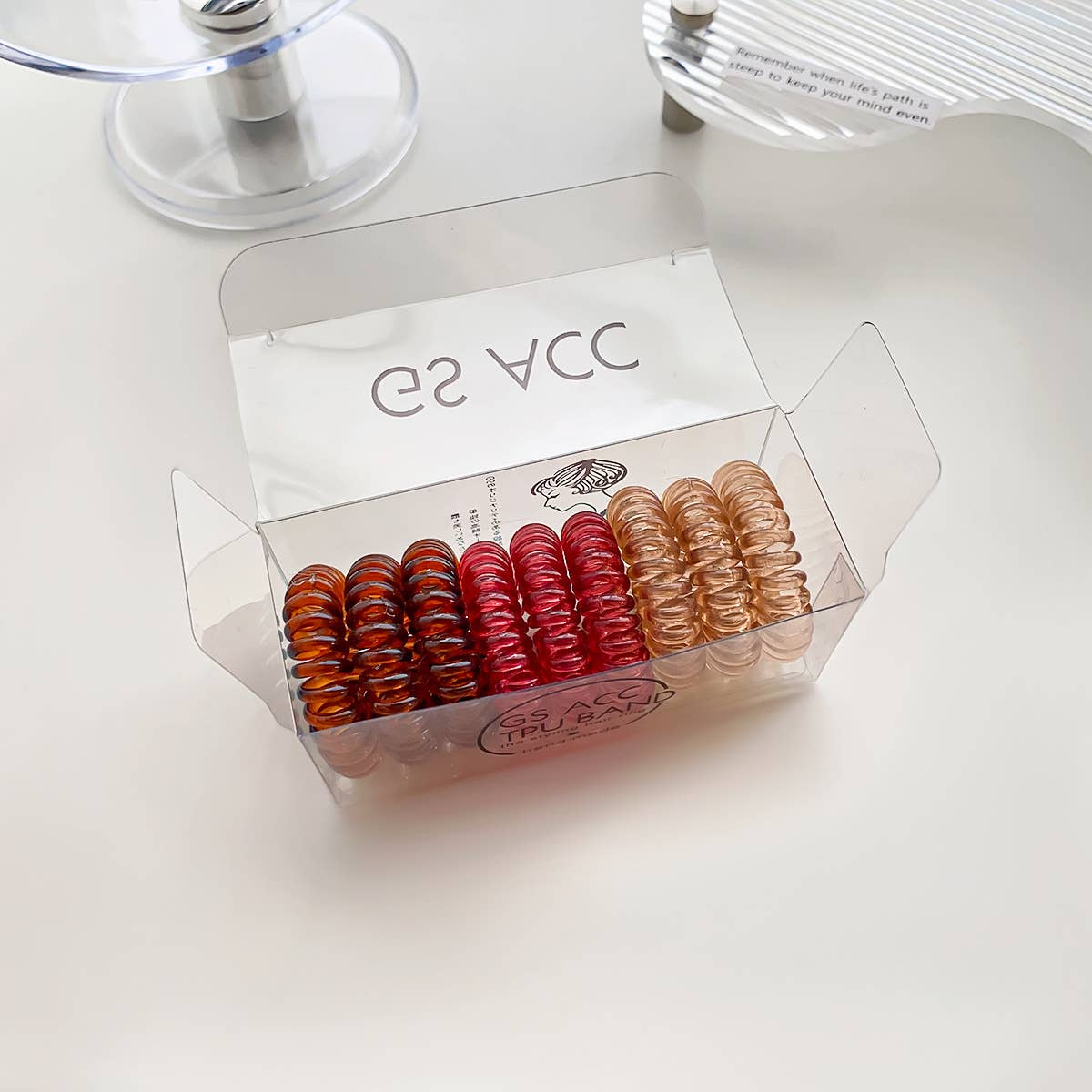 Nine candy-colored rubber bands for hair ties