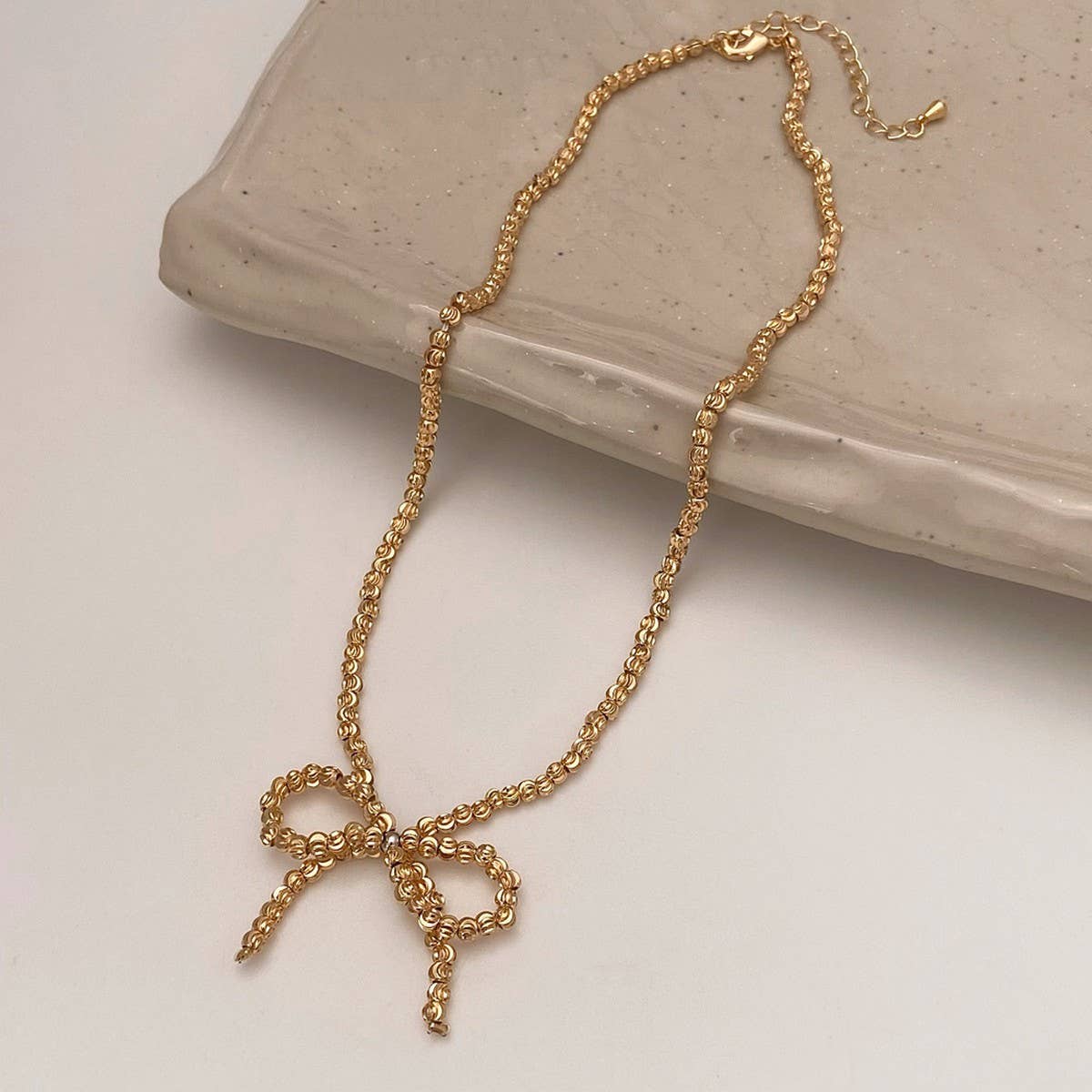 WEAR A HIGH-END METAL ROUND BEAD BOW NECKLACE