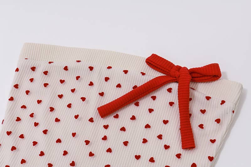 A bow-tied one-shoulder short strapless vest