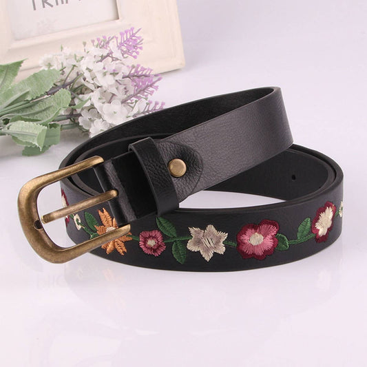 Embroidered flowers decorate a vintage belt