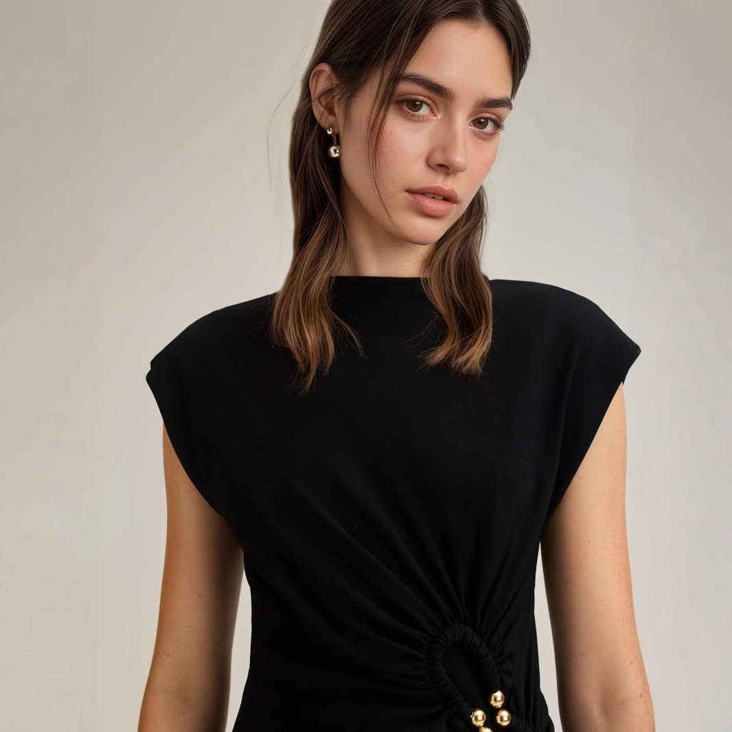Simple pleated buttons adorn the dress
