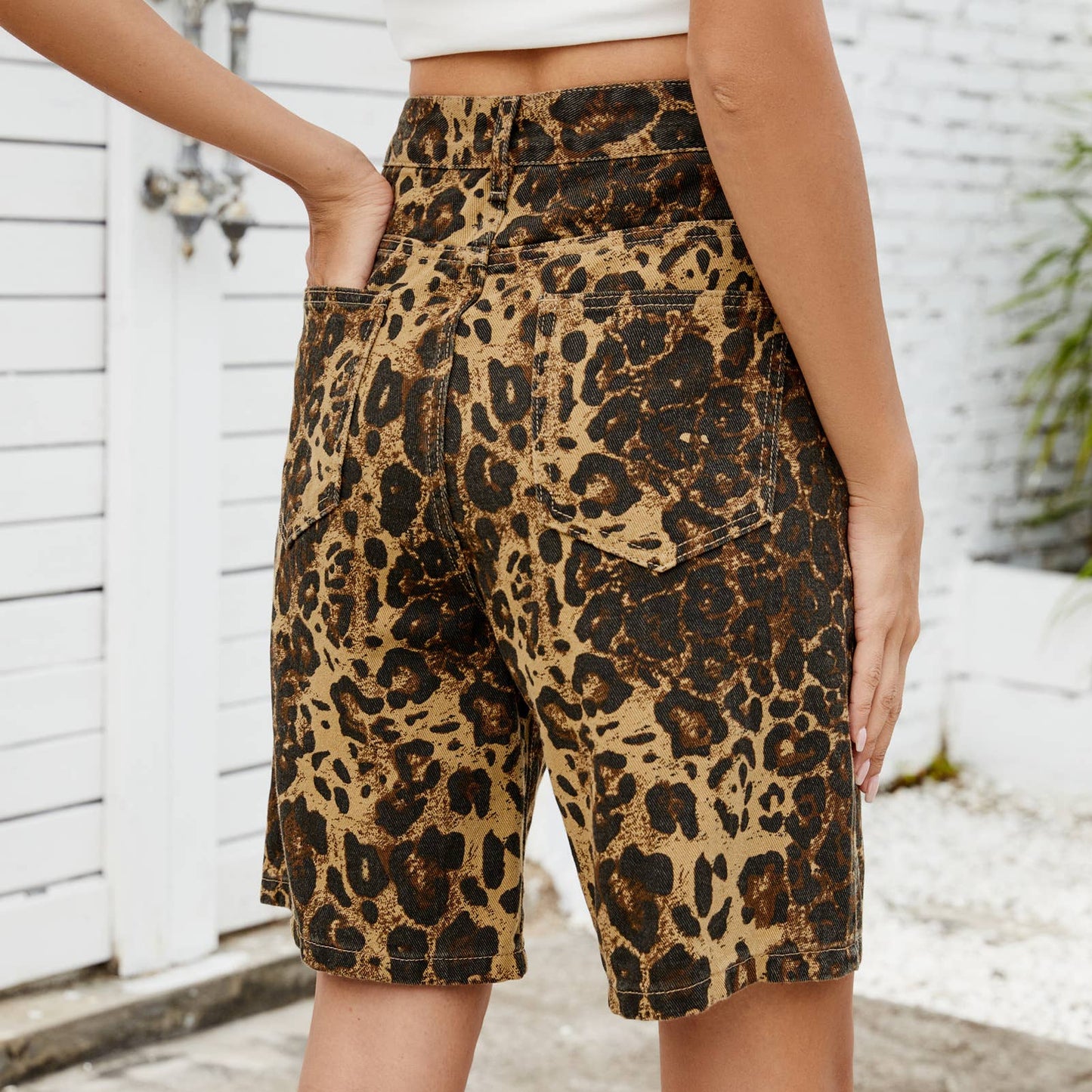 Washed vintage leopard print skinny denim shorts