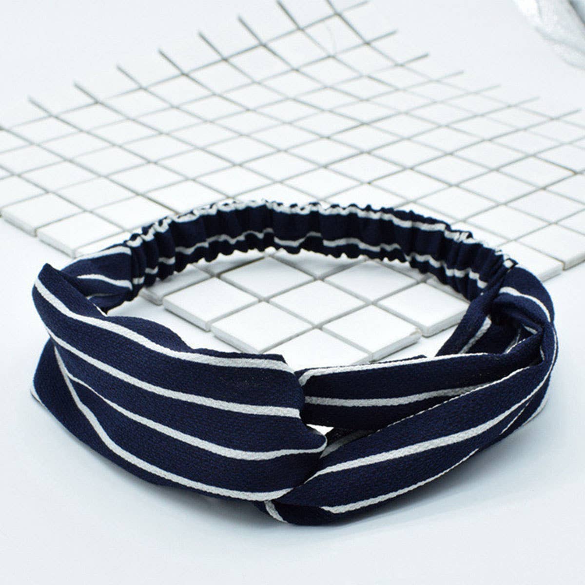 Silk hair band with interlaced patterns