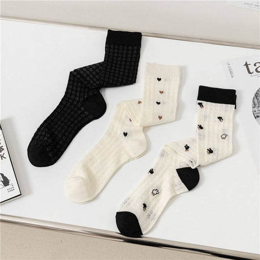 HOLLOW JACQUARD MIDDLE-CALF SOCKS