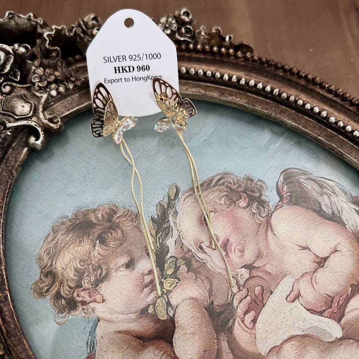 HOLLOW BUTTERFLY TASSEL EARRINGS