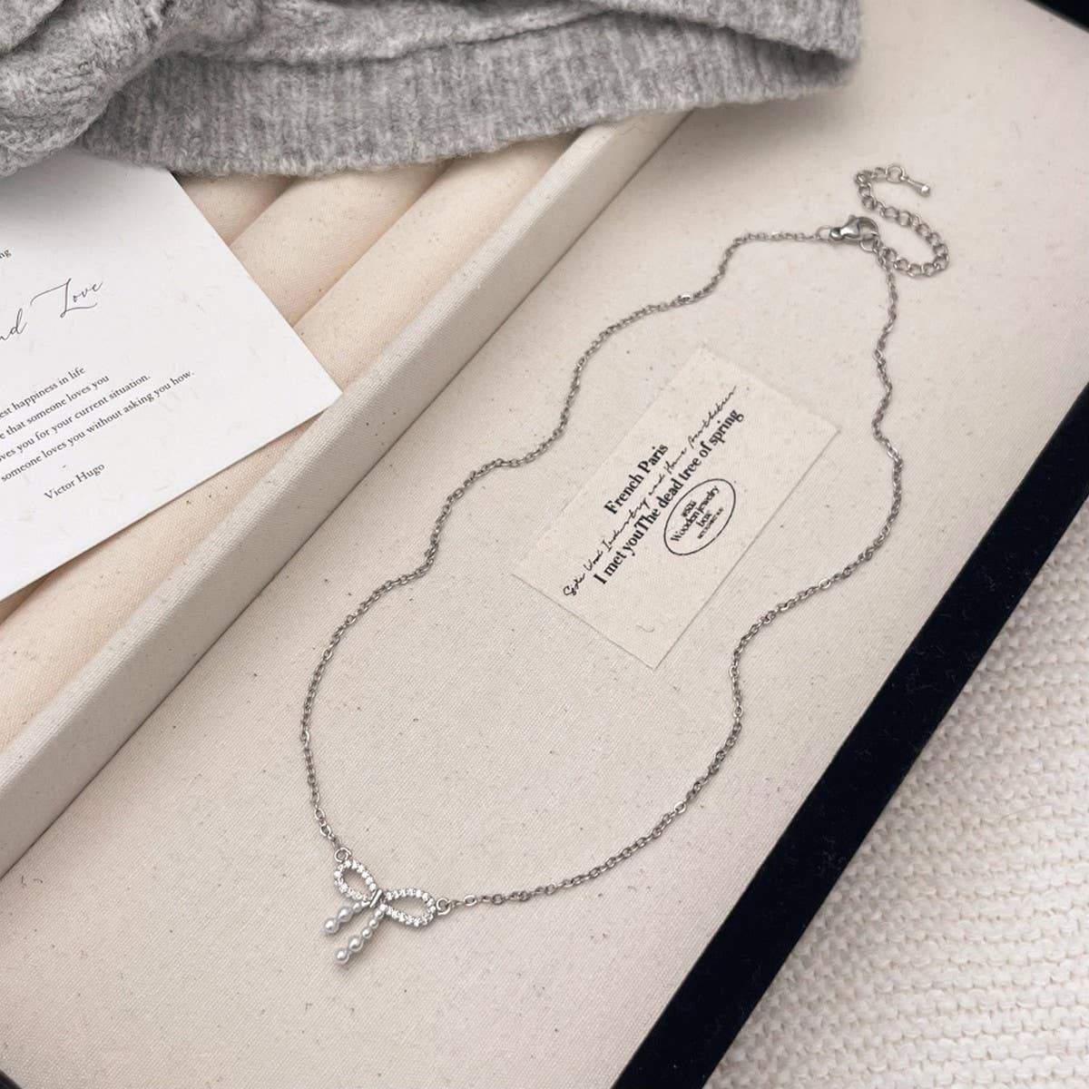 MICRO-PAVED ZIRCONIA PEARL BOW PENDANT NECKLACE