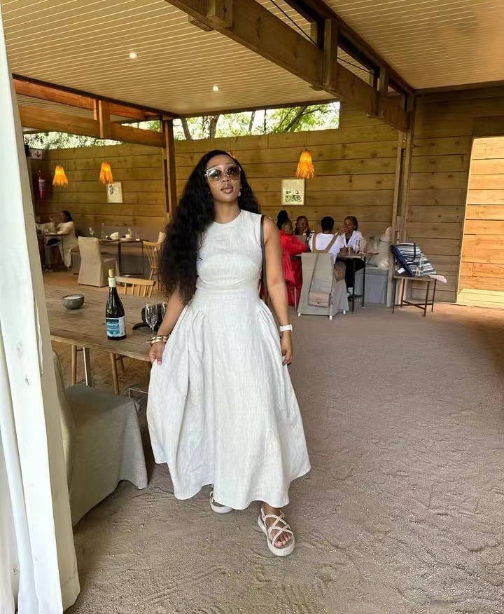 Sleeveless solid-color vest dress with large hem