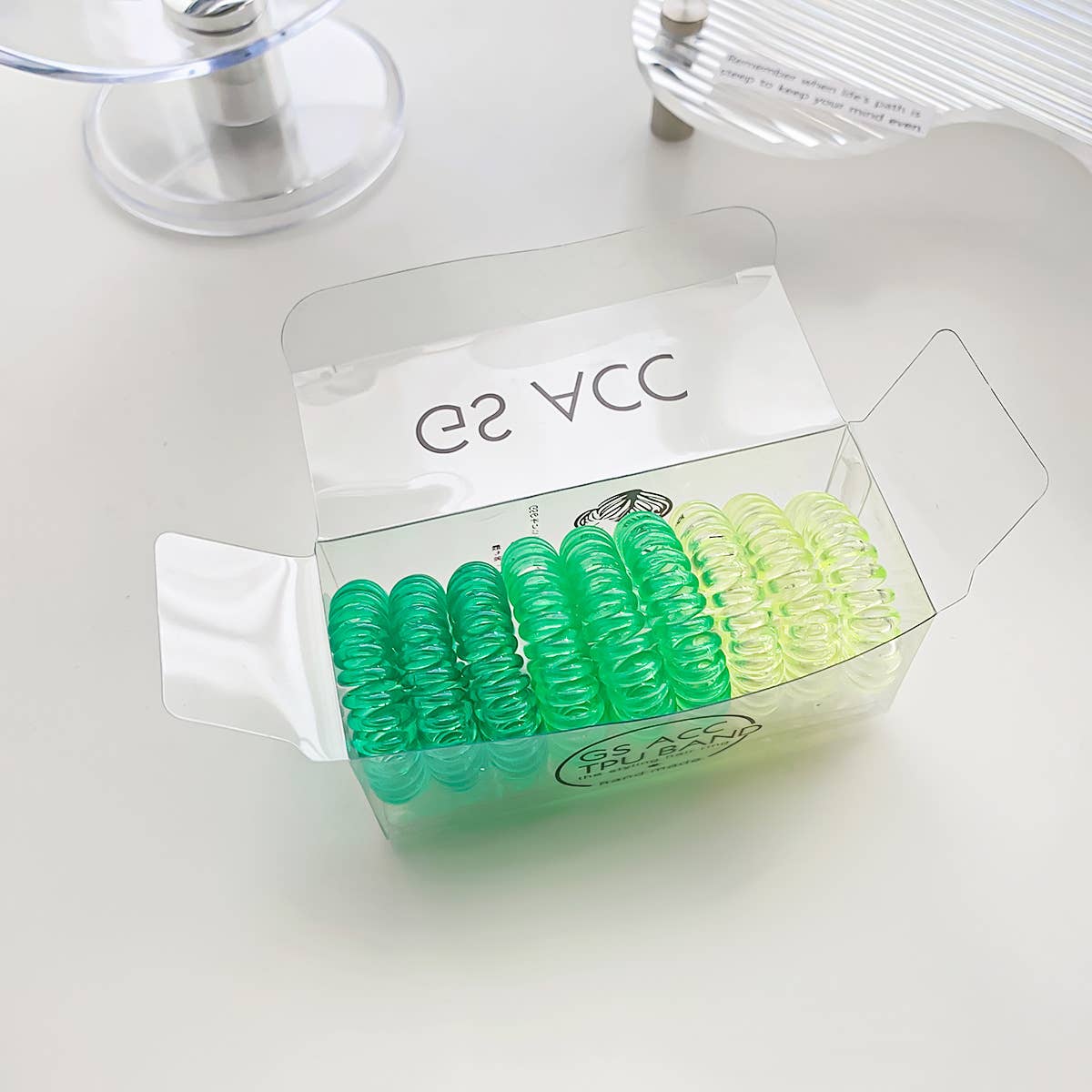 Nine candy-colored rubber bands for hair ties