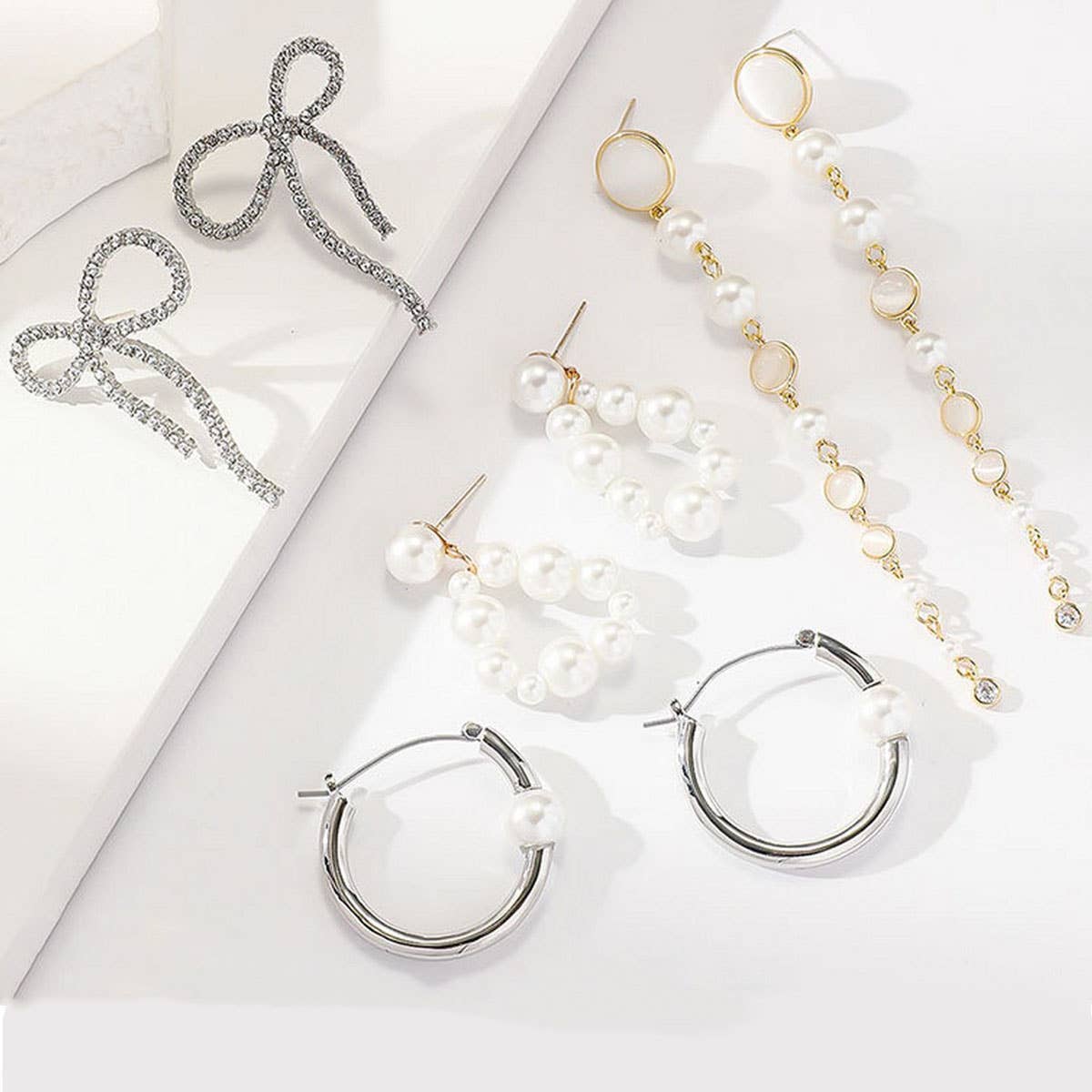 SMALL FRESH BOW PEARL INLAID ZIRCONIUM EARRINGS_CWAJE2851