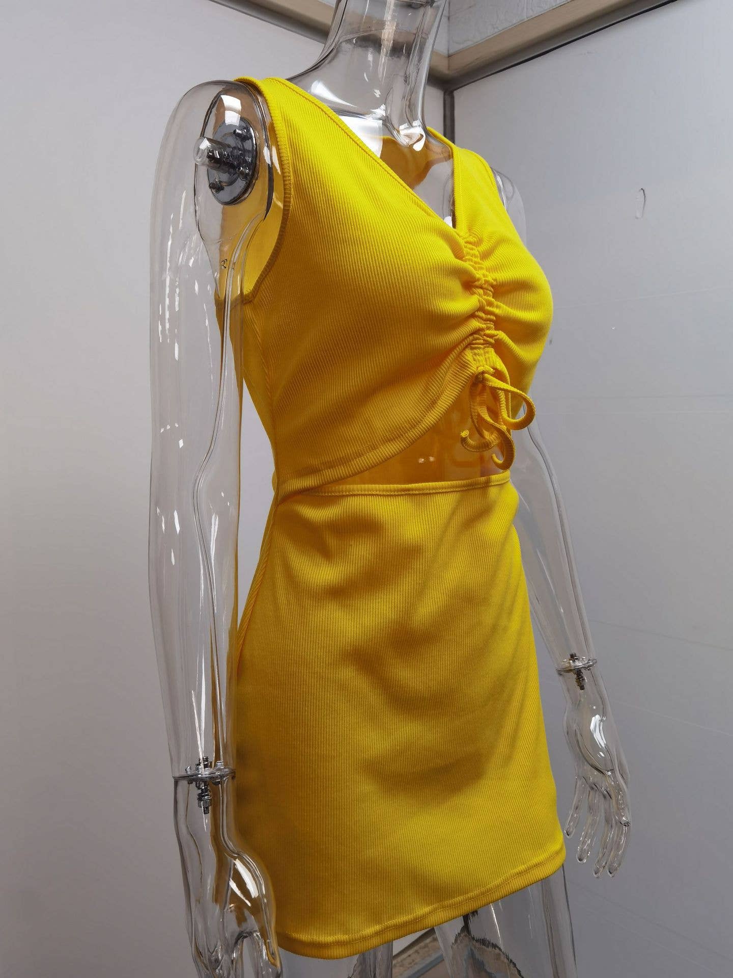 Tight-fitting dress with lace-up pleats