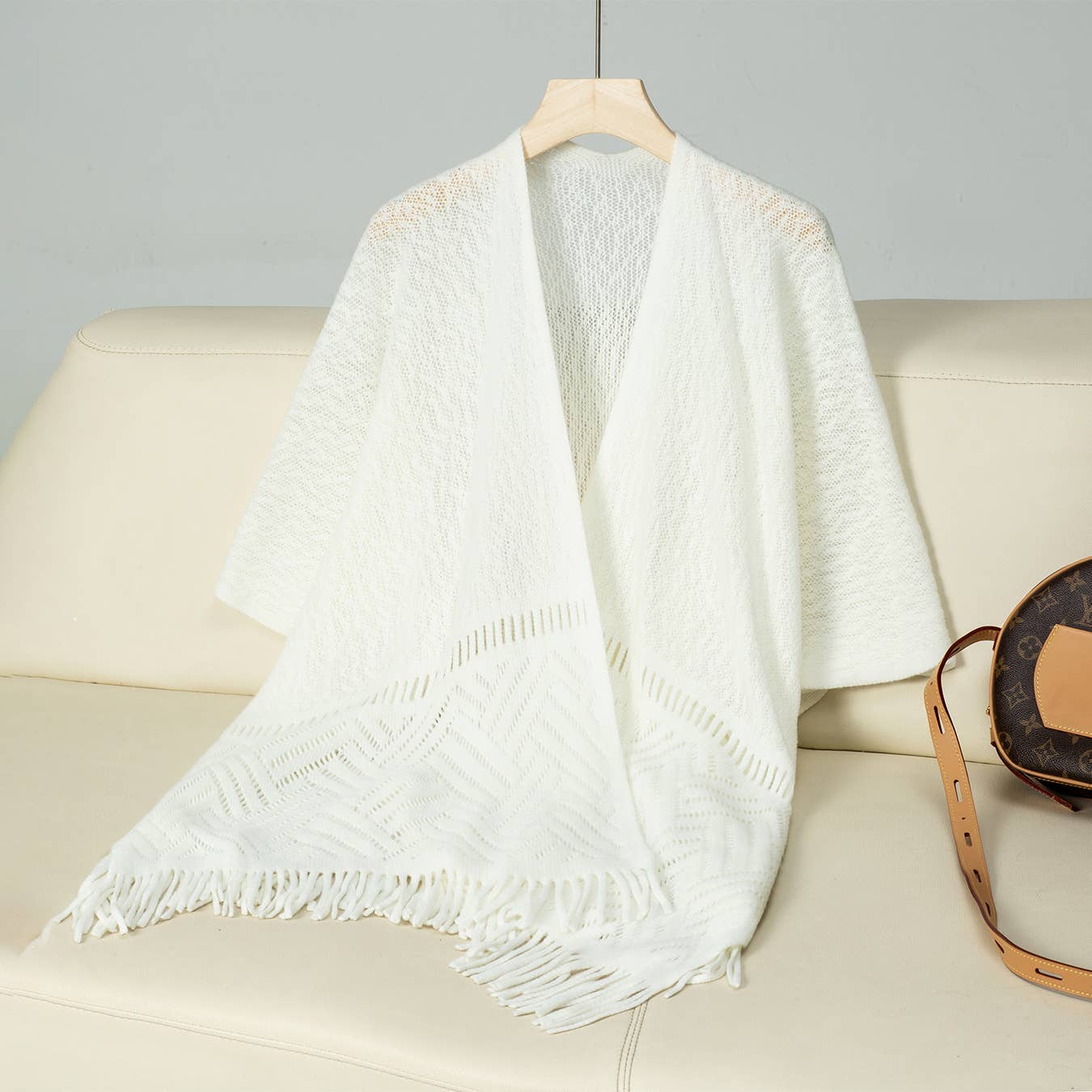 Solid colour hollow knit tassel cape cape