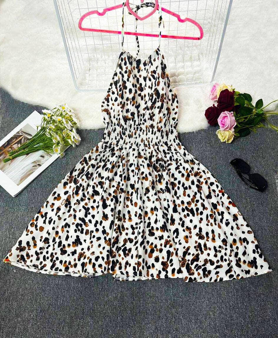 Sleeveless halter print vacation-style dress