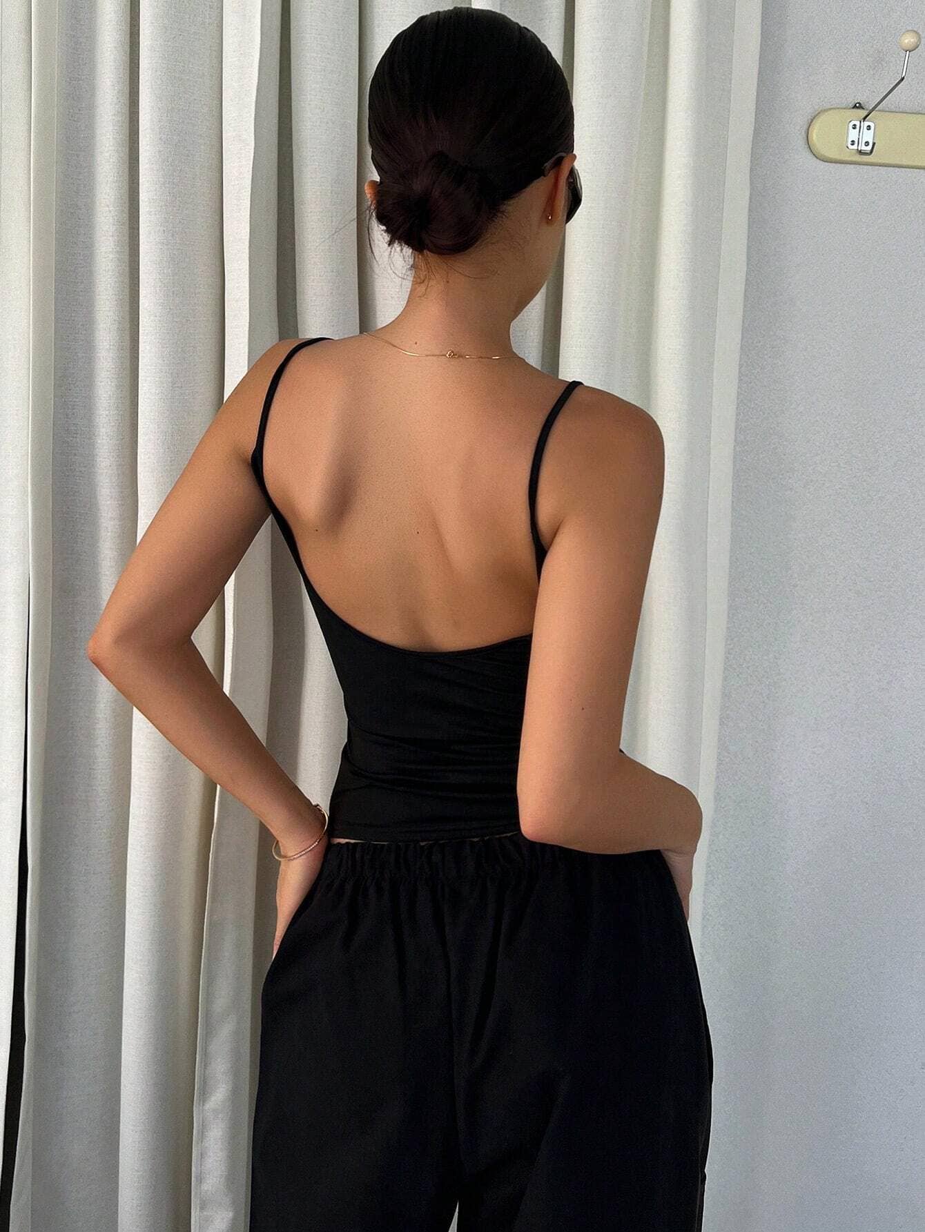 Solid-color backless, form-fitting halter top