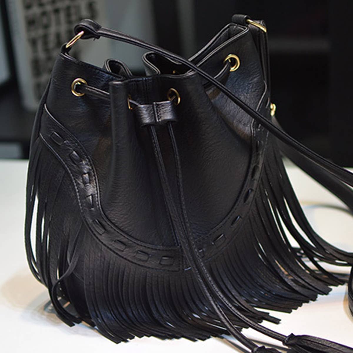 WOMEN LEATHER TASSEL BUCKET BAG_CWAB0791