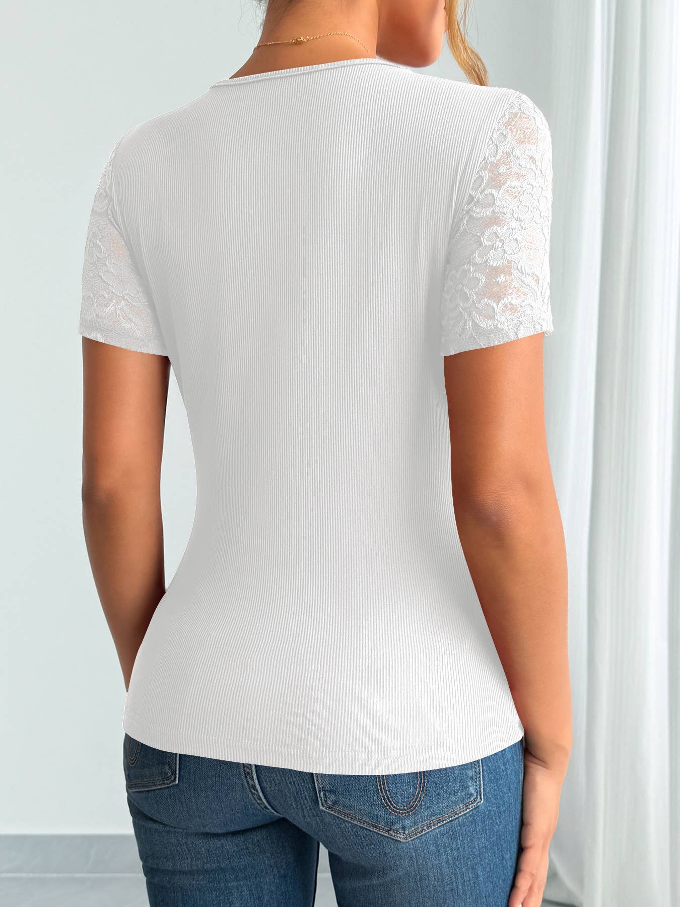 A lace-trimmed top with collared and cuffs