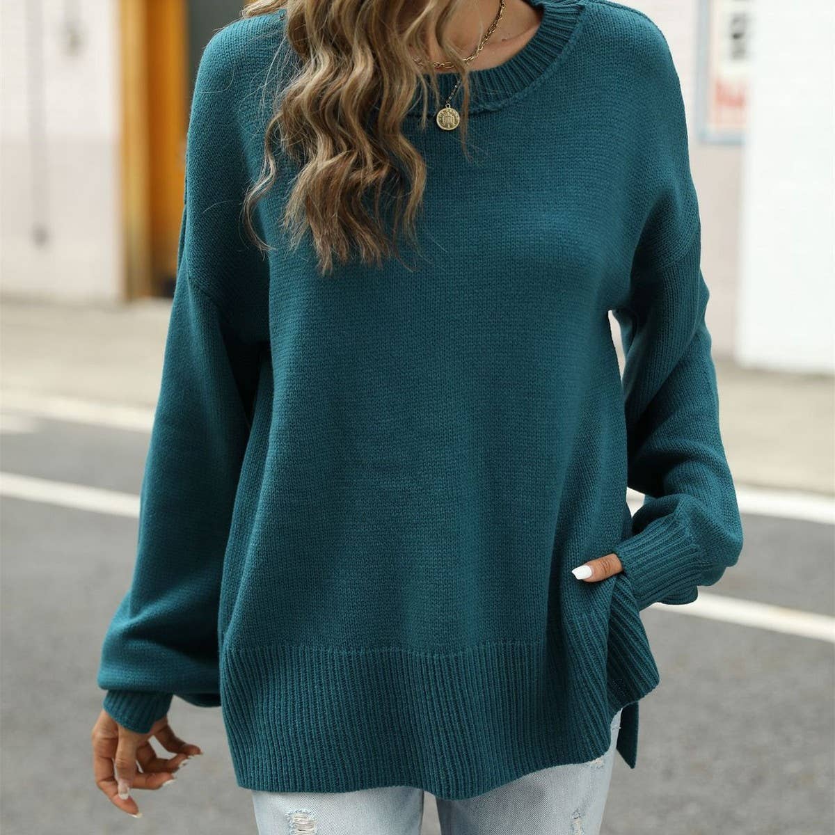 Short front and long irregular crew-neck sweater