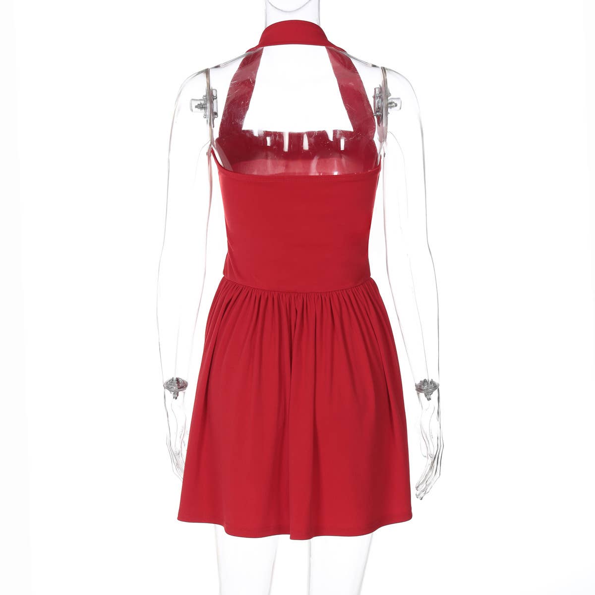 A halter, backless, high-waisted pleated dress