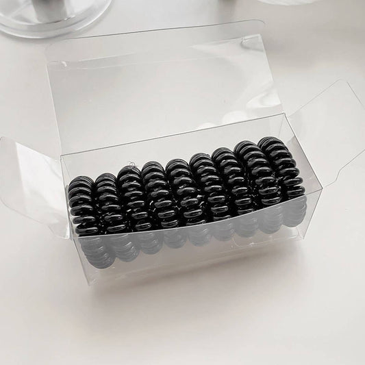 Nine candy-colored rubber bands for hair ties