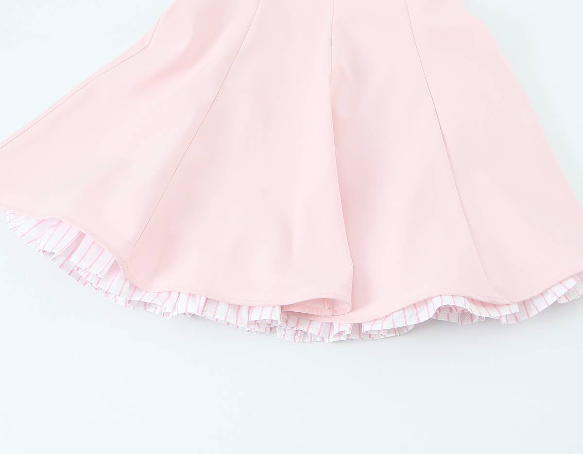 A short halter dress with striped patchwork