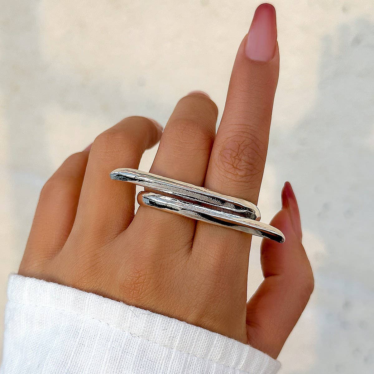 SIMPLE ASYMMETRICAL STATEMENT FRENCH RING