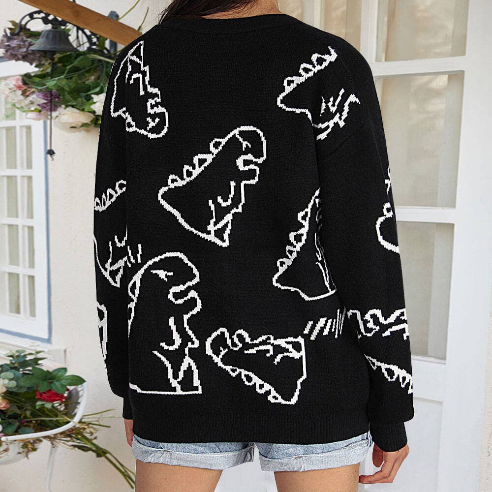 THE JACKET IS A LOOSE CARTOON DINOSAUR CARDIGAN