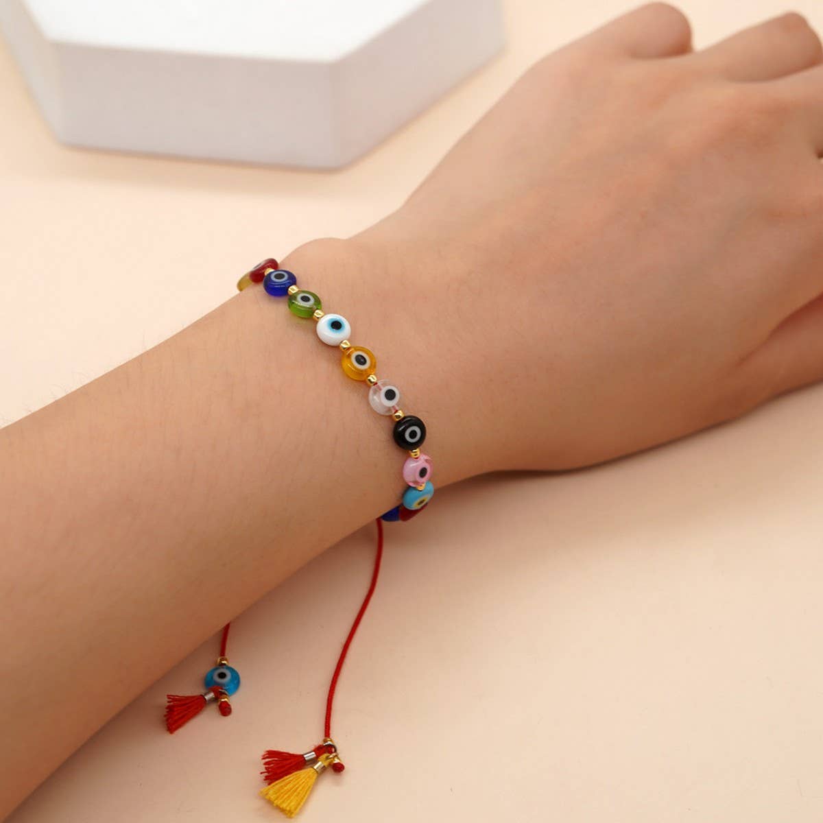 MIXED COLOR GLASS DISC EYE SMALL TASSEL BRACELET