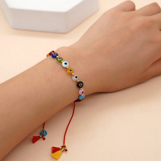 MIXED COLOR GLASS DISC EYE SMALL TASSEL BRACELET