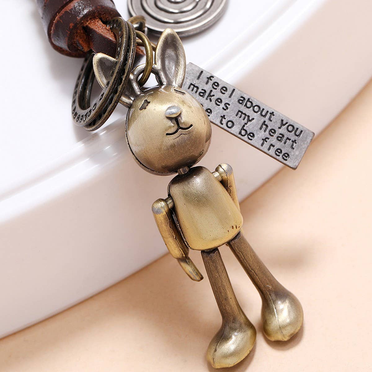 MOVABLE CARTOON ROBOT LEATHER KEYCHAIN