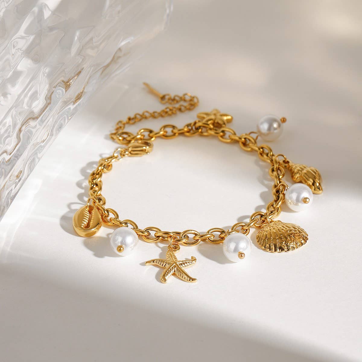 18K Gold Sea Charm Bracelet in Stainless Steel_CWAJE4641