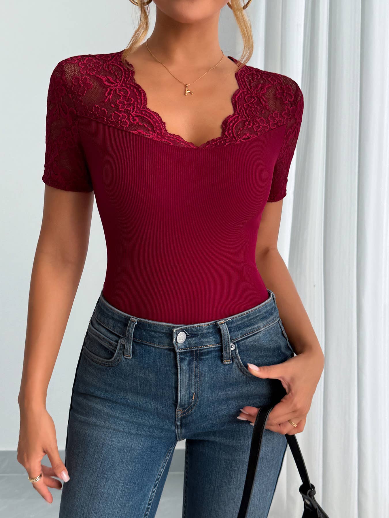 A lace-trimmed top with collared and cuffs