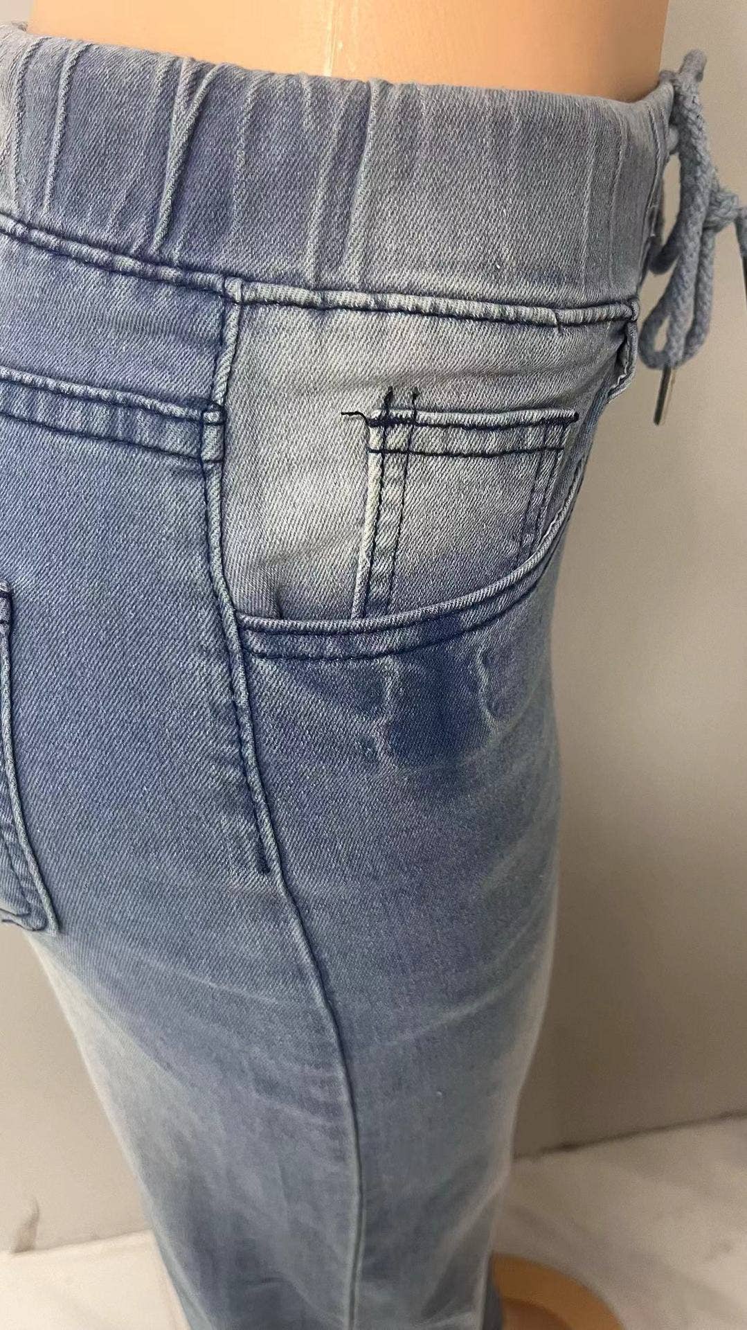 Lace-up waist-cinching straight-leg trousers