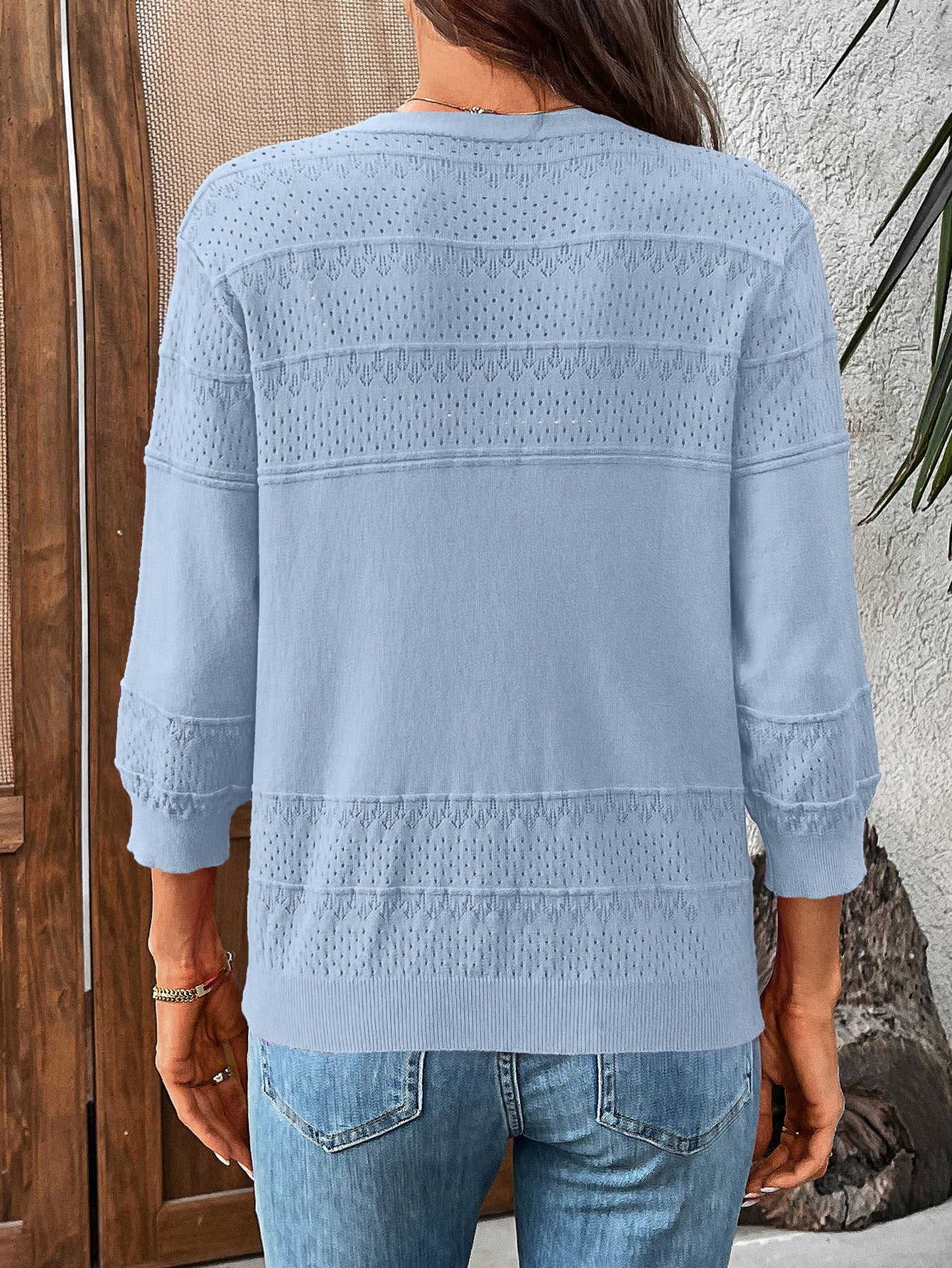 Three-quarter sleeve hollowed-out V-neck cardigan