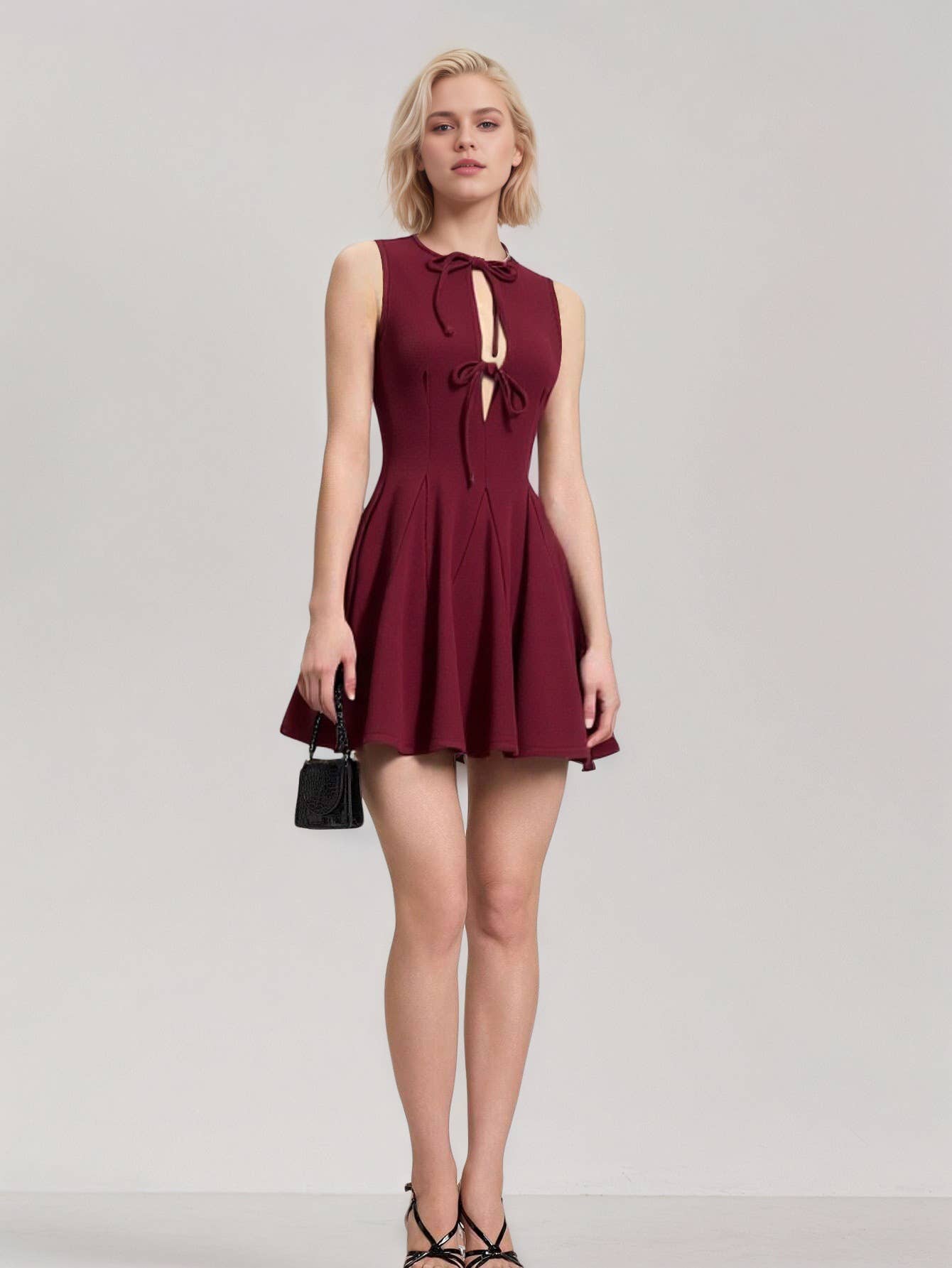 Fitted waist and bow tie sleeveless dress