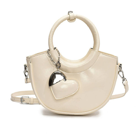 Fashionable and versatile hand-held crossbody bag