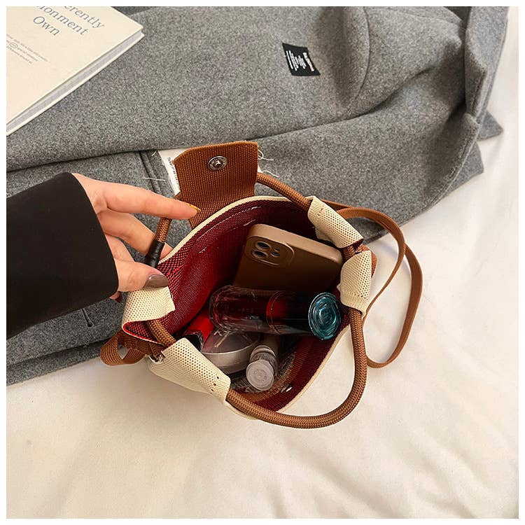 Lightweight and versatile hand-held crossbody bag