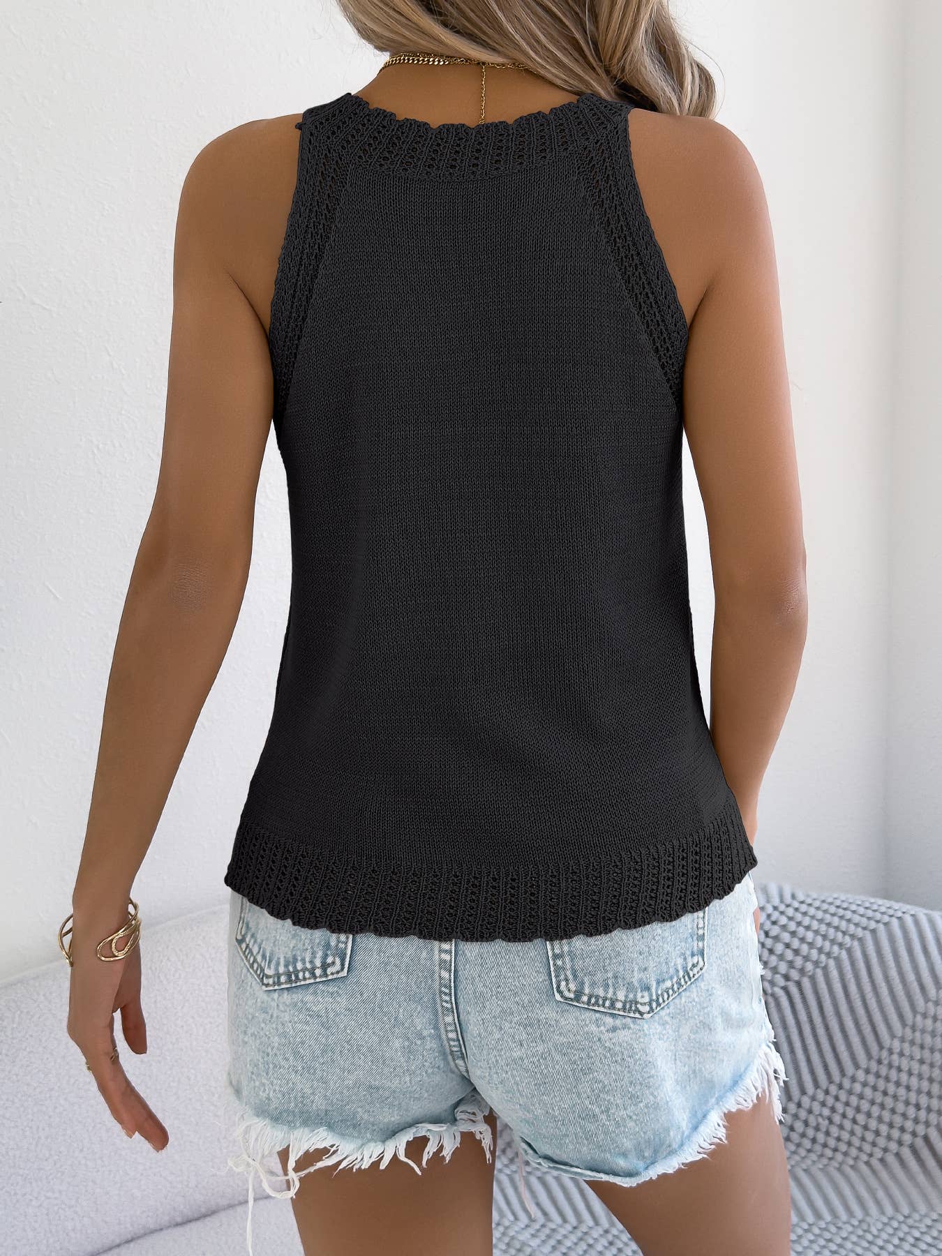 Solid-color hollowed-out sleeveless knitted top
