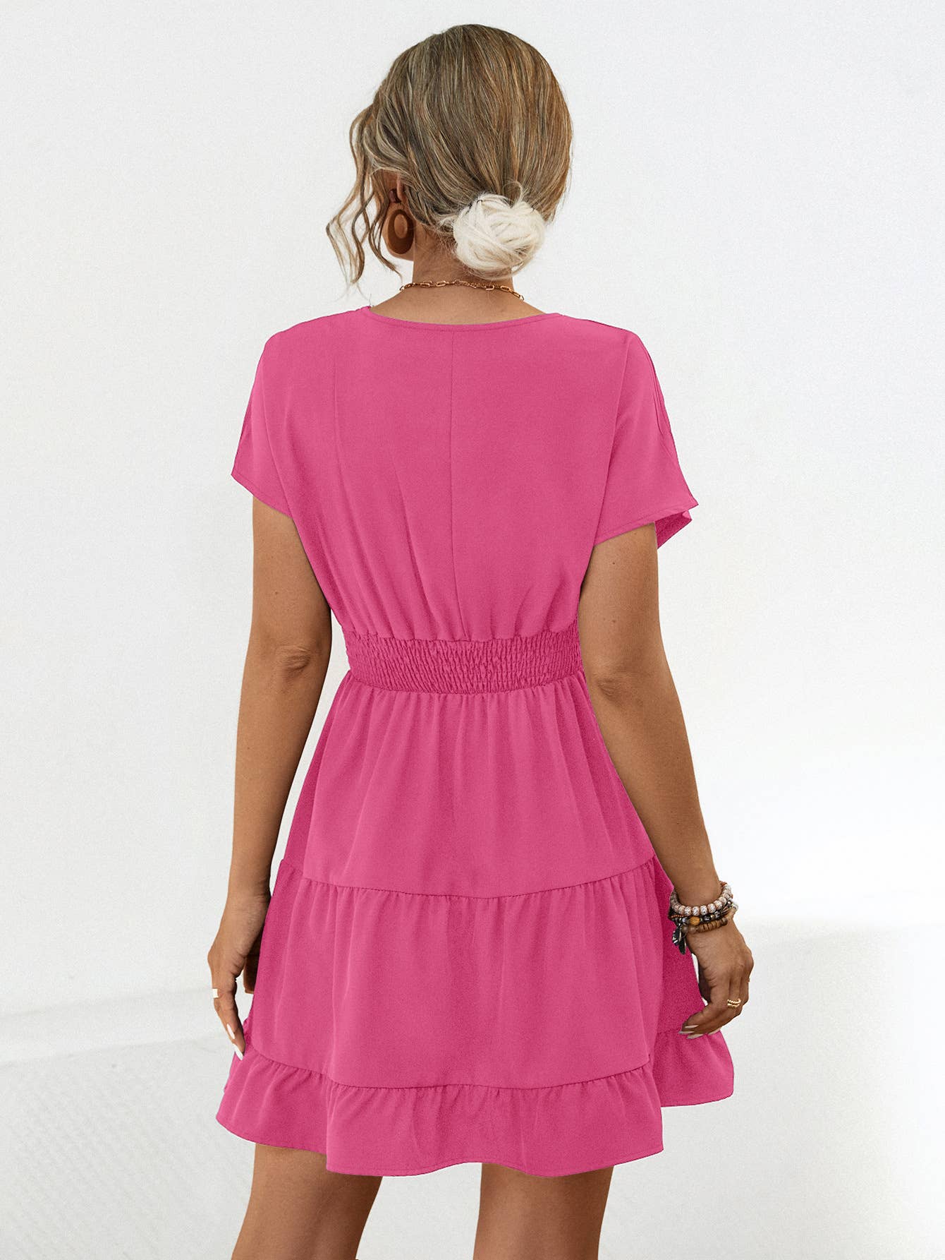 A V-neck solid color cinched short dress
