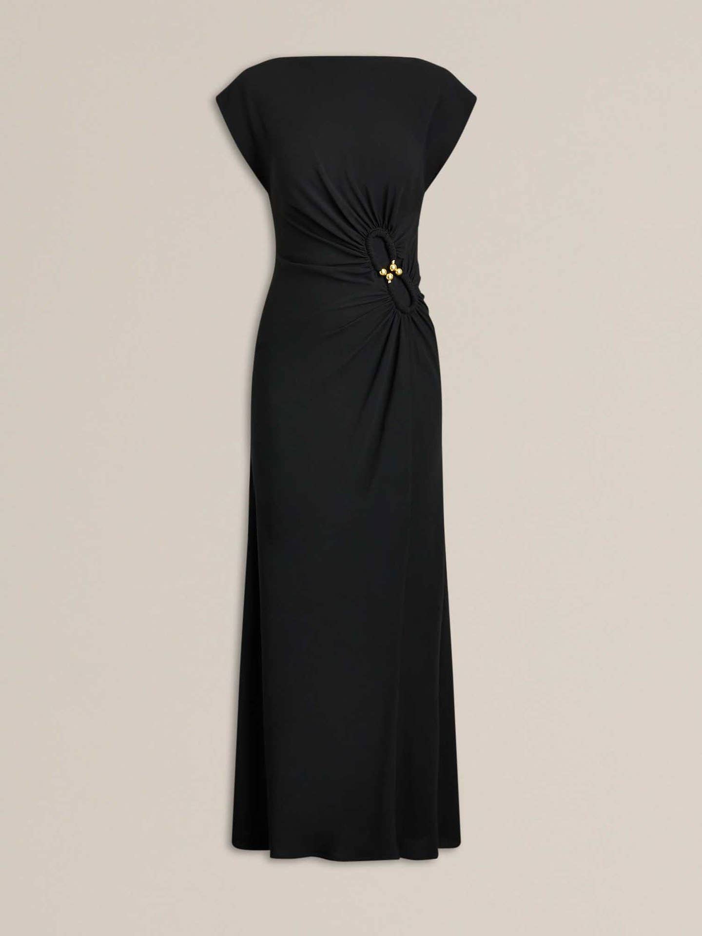 Simple pleated buttons adorn the dress