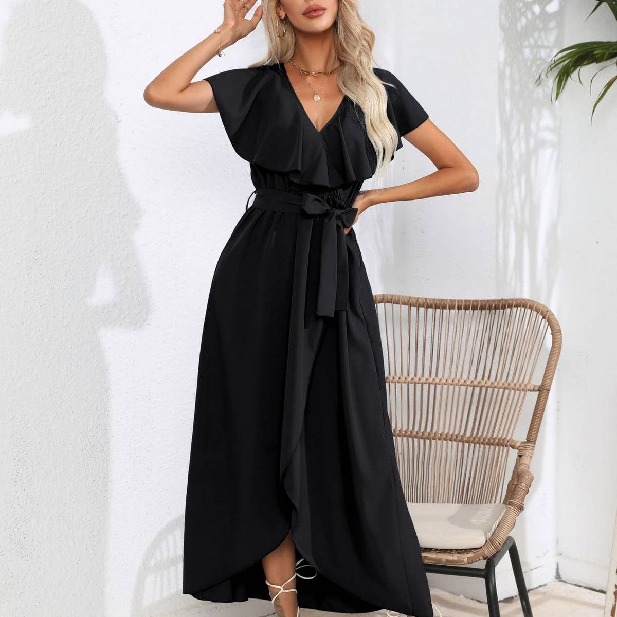Long sleeveless dress with ruffled V-neck