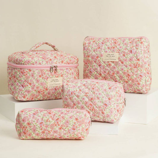 Four-piece set of quilted floral makeup bags