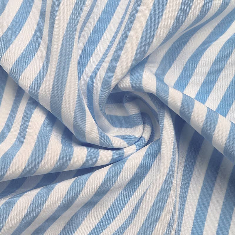 Resort-style striped ruffled strappy dress