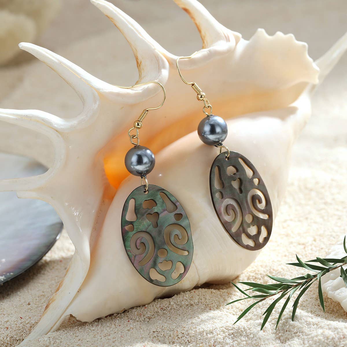 CREATIVE HOLLOW CARVED NATURAL SHELL EARRINGS