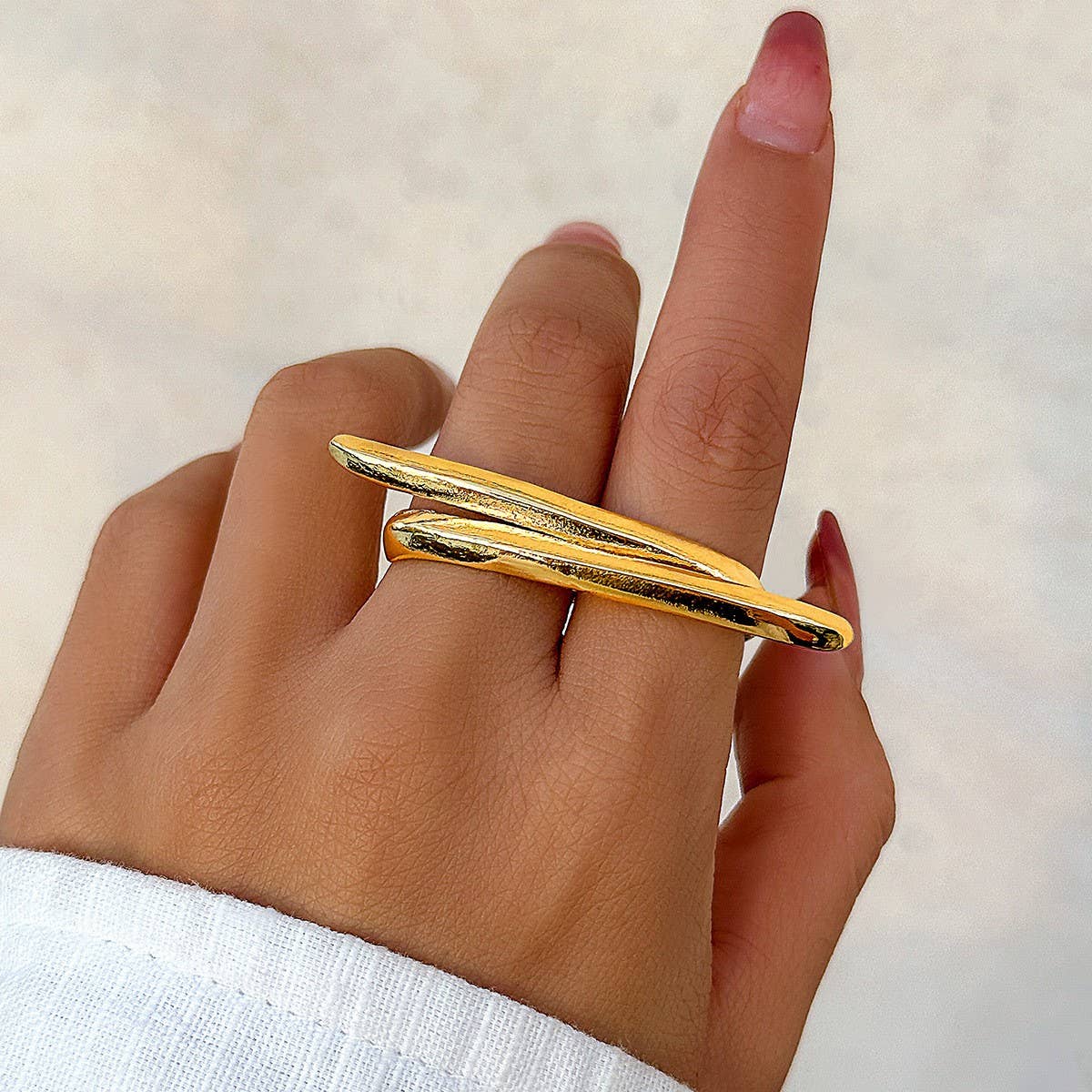 SIMPLE ASYMMETRICAL STATEMENT FRENCH RING
