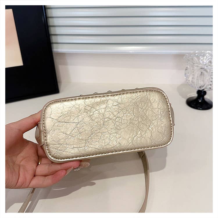 Fashionable riveted single-shoulder bag