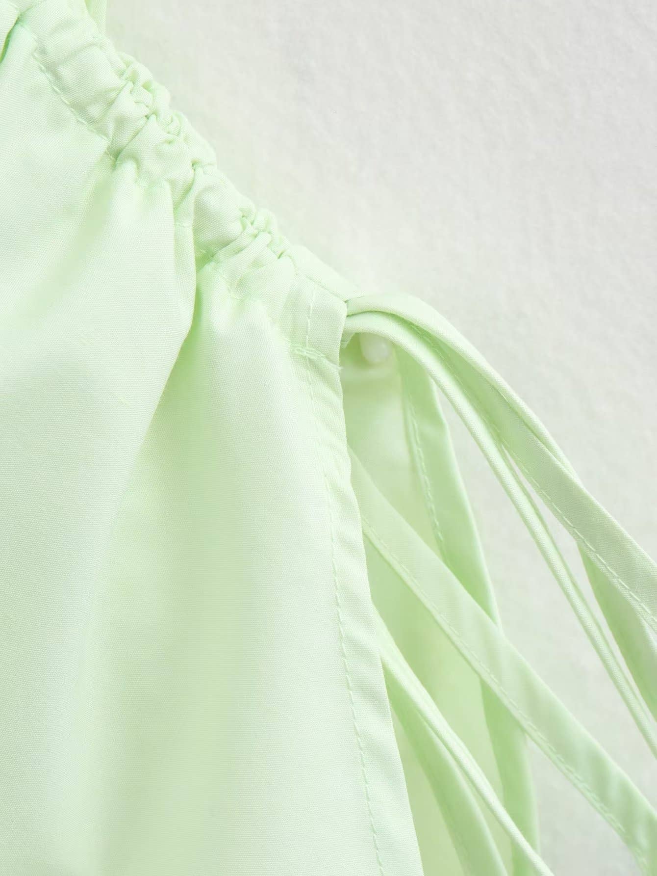 Side-drawstring long-sleeved solid-color shirt