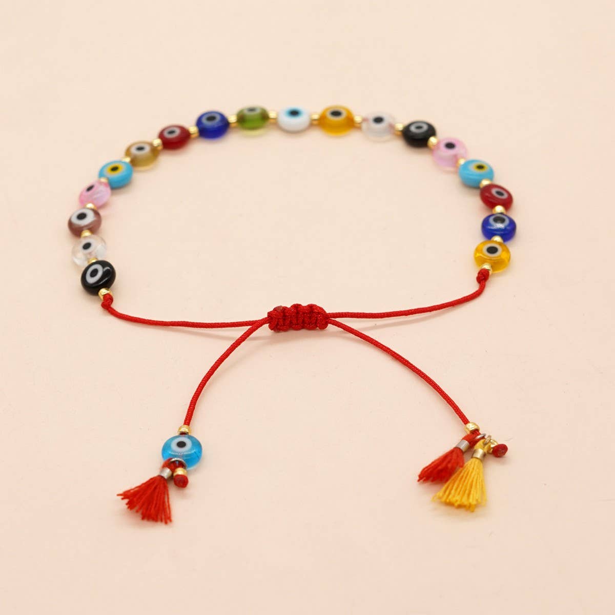 MIXED COLOR GLASS DISC EYE SMALL TASSEL BRACELET