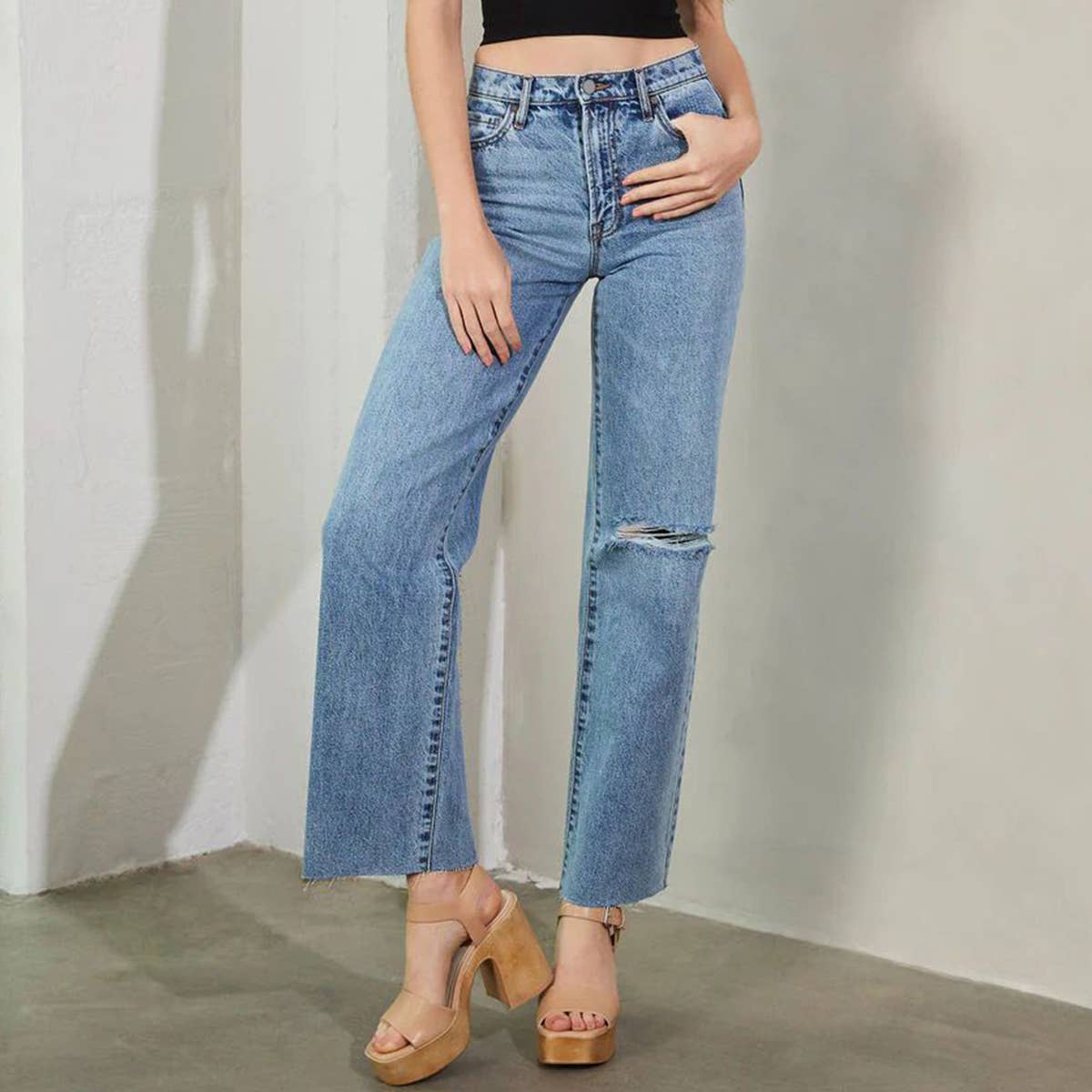High-waisted washed fashionable ripped jeans