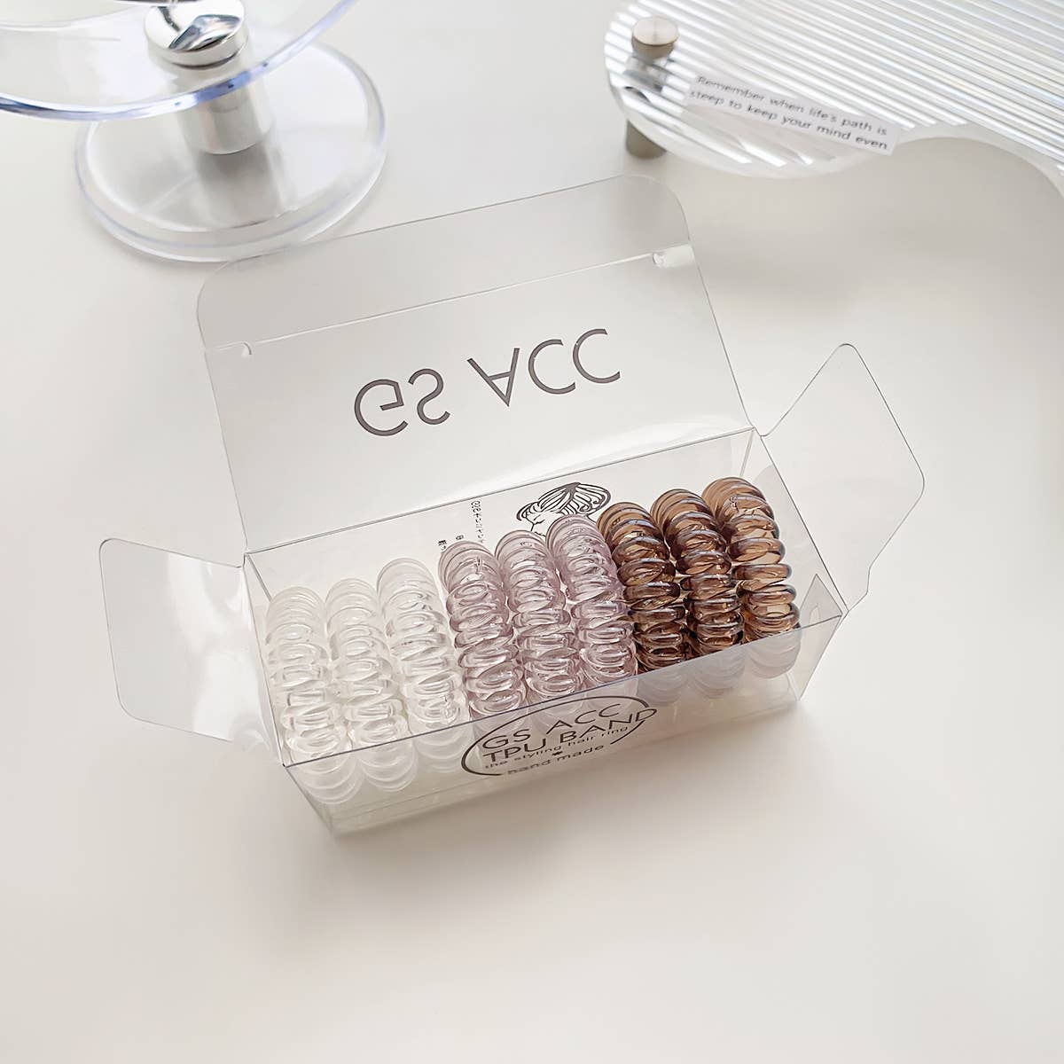 Nine candy-colored rubber bands for hair ties